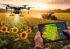 El agro ajusta el nitrógeno con drones: logran reducir más del 50% el fertilizante sin perder rendimiento Drone sobrevuela un cultivo de girasol mientras un tractor aplica fertilizante al atardecer, con monitoreo digital del lote para optimizar el uso de nitrógeno