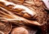 La Rural desafía el argumento del pan: el trigo explica apenas el 6,7% de su precio final Trigal maduro combinado con panes artesanales recién horneados en panadería argentina, representando la cadena del trigo y la producción alimentaria.