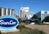 Un tribunal frenó la venta de SanCor y ahora nadie sabe cuánto debe realmente: el proceso que se complicó Planta industrial de SanCor con tanques de almacenamiento, edificios de producción y cartelería de la empresa.