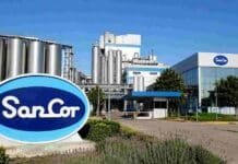 Un tribunal frenó la venta de SanCor y ahora nadie sabe cuánto debe realmente: el proceso que se complicó Planta industrial de SanCor con tanques de almacenamiento, edificios de producción y cartelería de la empresa.